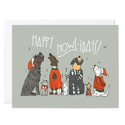 Hand illustrated greeting card of Wirehaired Pointing Griffon, French Bulldog, German Shorthaired Pointer, Poodle, Rottweiler, Yorkshire Terrier, and Terrier mix singing carols. White hand lettered words read Happy Howl-idays on green background.