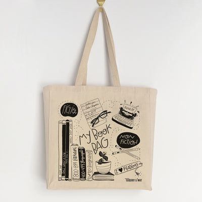 My Book Bag" tote with whimsical illustrations of reading glasses, books, and the Dewey Decimal System.