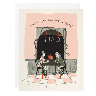 Illustrated holiday greeting card with drawing of a cafe scene where two girls are chatting over a table in front of a window.