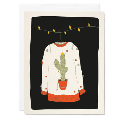 Illustrated holiday greeting card southwest cactus ugly sweater and rainbow colored pompoms, hanging on a string of yellow lights, on a black background.