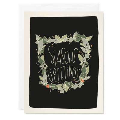 Illustrated holiday greeting card reads seasons greetings with holly drawings on black background