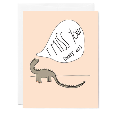 Hand illustrated greeting card featuring drawing of green dinosaur on pink background with hand lettered words reading 'I Miss You, that's all'