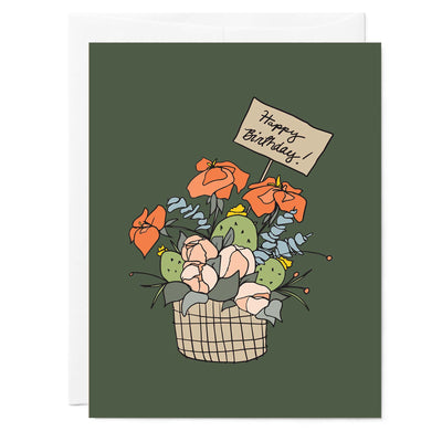 A modern floral basket with the words "Happy Birthday" on a deep green background.