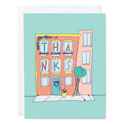 A thank-you card with a modern brownstone design featuring pastel colors and the word "thanks" in the window.