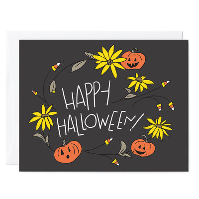 Hand illustrated greeting card of Happy Halloween card with sunflowers, jack-o-lanterns, and candy corn. Grey background