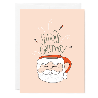 Hand illustrated greeting card with drawing of vintage retro Santa mug of hot chocolate. Hand lettered words say Season's Greetings.